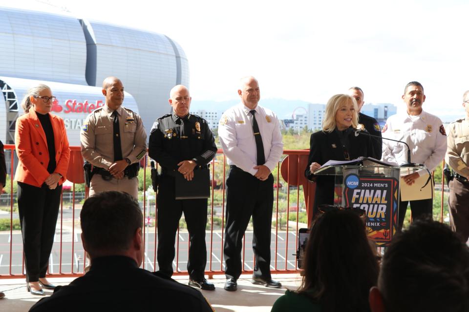 From a balcony overlooking State Farm Stadium on April 1, 2024, Jay Parry, the CEO of the 2024 Phoenix Men’s Final Four Host Committee, leads a news conference for local and state officials to discuss public safety plans ahead of this weekend's events in the Valley.