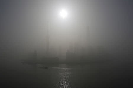 A general view of Shanghai's financial district of Pudong amid heavy smog is seen in Shanghai. REUTERS/Aly Song