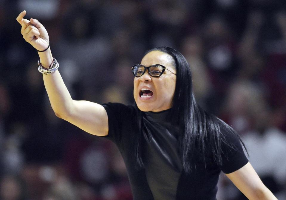 FILE - In this March 5, 2017, file photo, South Carolina head coach Dawn Staley directs her team during the first half of an NCAA college basketball game against Mississippi State in the Southeastern Conference tournament in Greenville, S.C. Two people with knowledge of the decision say Dawn Staley will be the next U.S. women's basketball Olympic coach. They spoke to The Associated Press Thursday, March 9, 2017, on condition of anonymity because the decision hasn't been publicly announced. (AP Photo/Rainier Ehrhardt, File)