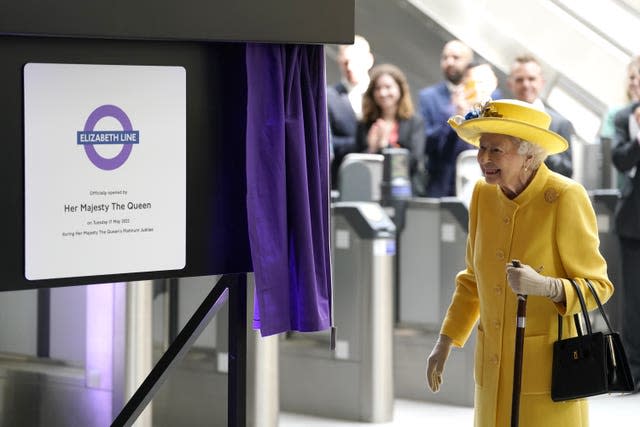 The Queen unveils a plaque a Paddington station to mark the opening of the Elizabeth line.