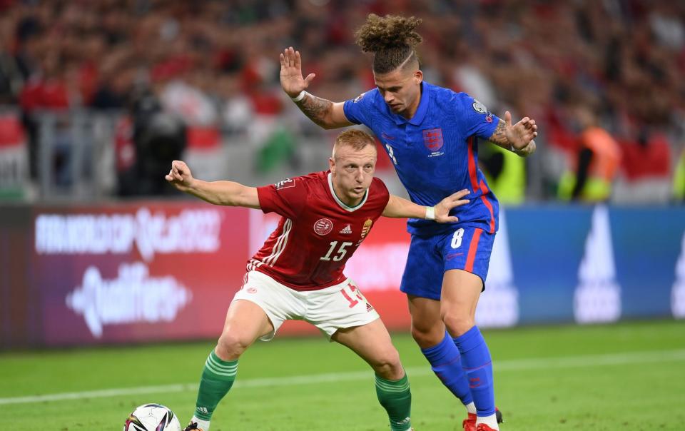 Kalvin Phillips of England and Laszlo Kleinheisler of Hungary battle for the ball during the 2022 FIFA World Cup Qualifier match between Hungary and England at Stadium Puskas Ferenc on September 02, 2021 in Budapest, Hungary. - GETTY IMAGES