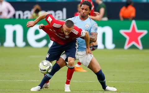 Douglas Luiz, playing for Manchester City, battles for the ball with Bayern Munich's Franck Ribery - Credit: afp