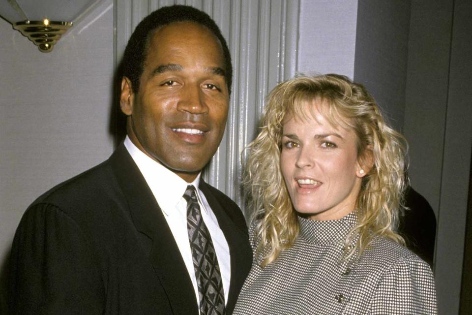 <p>Ron Galella/Ron Galella Collection via Getty</p> O.J. and Nicole Brown Simpson in 1989.