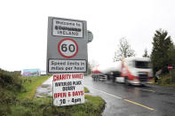 In this photo dated Monday Oct. 14, 2019 vehicles cross the border between the Republic of Ireland an Northern Ireland. After Brexit, the frontier will become an external border once again, and negotiators are struggling to find a way to regulate trade without rebuilding checkpoints and destroying the cross-border links that have spurred economic growth on both sides. (AP Photo/Peter Morrison)