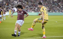 Colorado Rapids midfielder Braian Galván, left, stops a kick by Real Salt Lake defender Bryan Oviedo, right, in the second half of an MLS soccer match Saturday, May 20, 2023, in Commerce City, Colo. (AP Photo/David Zalubowski)