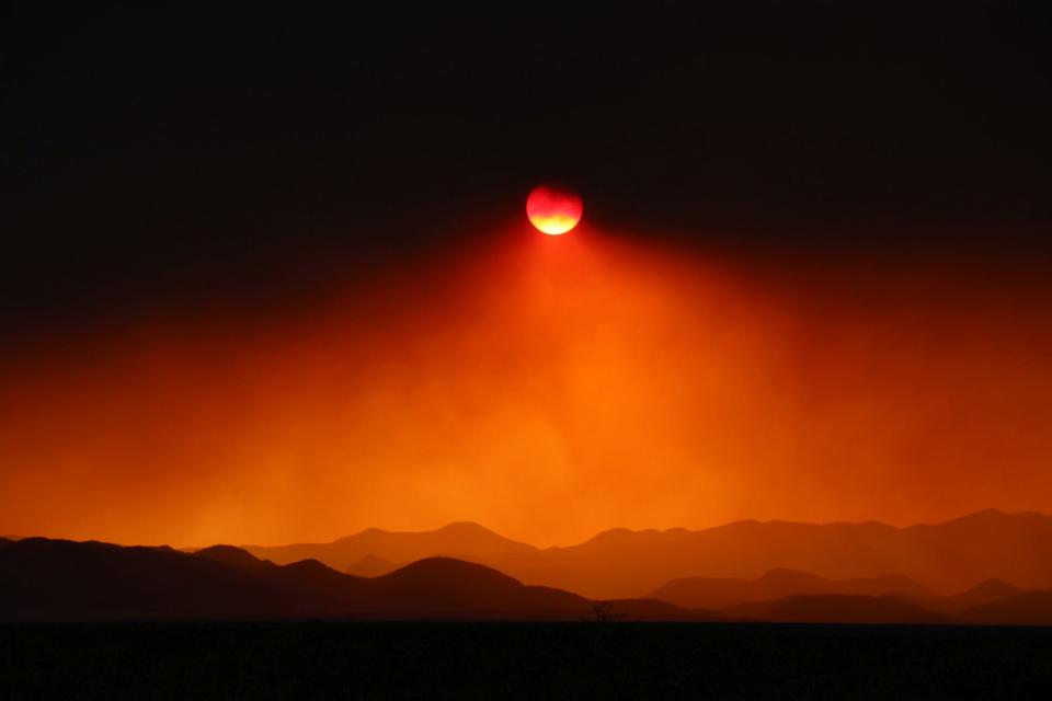 Smoke from the Black Fire in the Gila National Forest  blocks the sun Monday, May 16, 2022 at 7:30 p.m. on Interstate 25 north of Truth or Consequences.