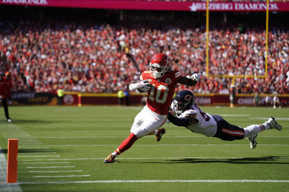 Kansas City Chiefs running back Isiah Pacheco (10) runs with the ball as Chicago Bears linebacker T.J. Edwards defends during the first half of an NFL football game Sunday, Sept. 24, 2023, in Kansas City, Mo. (AP Photo/Ed Zurga)