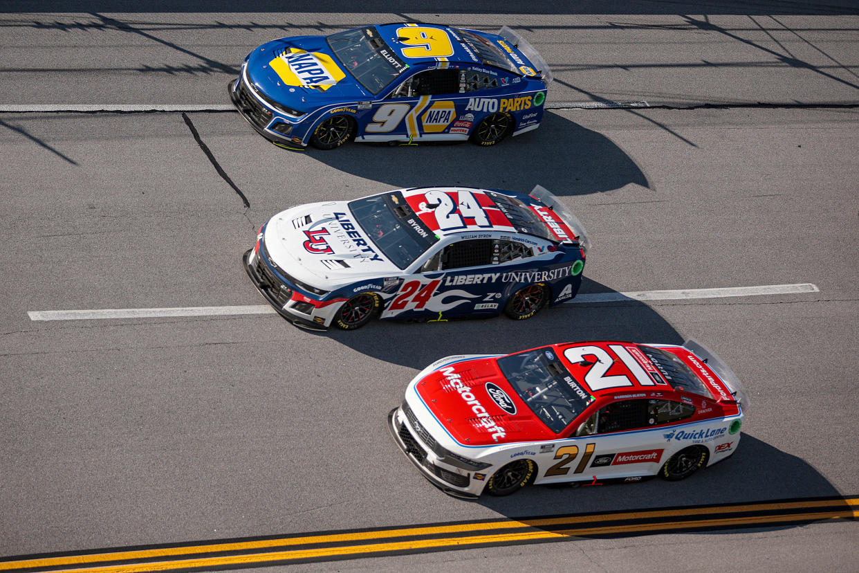 TALLADEGA, ALABAMA - APRIL 21: Chase Elliott, driver of the #9 NAPA Auto Parts Chevrolet, William Byron, driver of the #24 Liberty University Chevrolet, and Harrison Burton, driver of the #21 Motorcraft/Quick Lane Ford, race during the NASCAR Cup Series GEICO 500 at Talladega Superspeedway on April 21, 2024 in Talladega, Alabama. (Photo by James Gilbert/Getty Images)