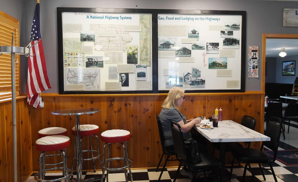 Historic photos and information about the Jefferson Highway and Lincoln Highway are on display at Niland's Cafe, located at 24 Lincoln Way in Colo. The picture was taken on Wednesday.