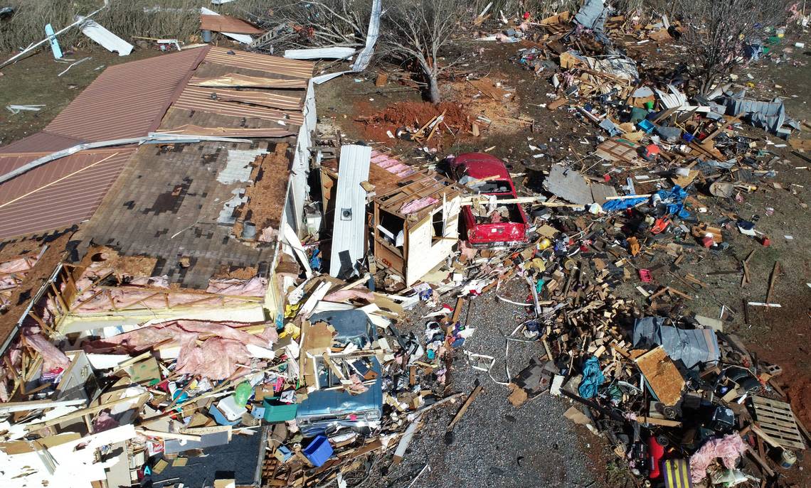 The contents of a mobile home in the Fox Hollow area along Cindi Lane are strewn across the property following a suspected tornado in Claremont, NC on Tuesday, January 9, 2024. The suspected tornado which was part of a massive storm system that covered much of the southeast on Tuesday left one dead.