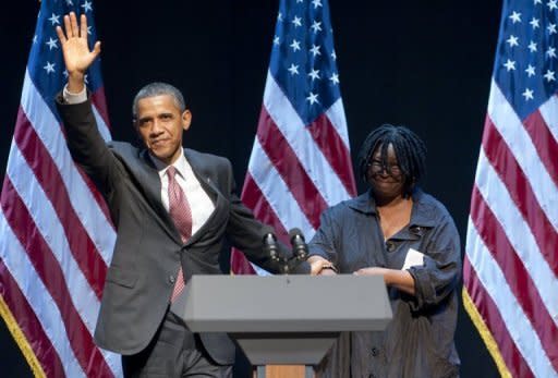 US President Barack Obama greets actress Whoopi Goldberg (R) prior to speaking following a special fundraising performance of the Broadway musical "Sister Act" on behalf of the Democratic National Committee at the Broadway Theatre in New York, June 23, 2011. AFP PHOTO / Saul LOEB