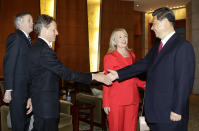 BEIJING, CHINA - MAY 3: U.S. Treasury Secretary Timothy Geithner (2nd L) shakes hands with China's Vice President Xi Jinping next to U.S. Secretary of State Hillary Clinton (C) during a meeting at Diaoyutai State Guesthouse on May 3, 2012 in Beijing. Hillary Clinton is in China for bilateral talks and has called on China to protect human rights. Chinese activist Chen Guangcheng has reportedly said he wishes to leave China on the U.S. Secretary of State's plane when she heads back to the U.S. later this week. (Photo by Jason Lee/Pool/Getty Images)