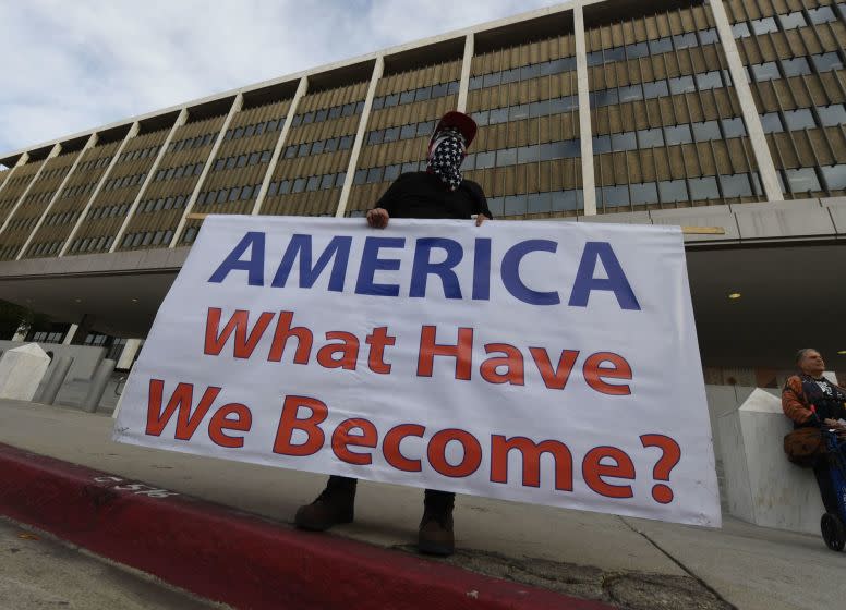 Immigrant rights groups protest on January 29, 2018, outside the Federal Building in Los Angeles, against the arrest of a Tucson-based 'No More Deaths' group activist. The activist was arrested by border patrol in a remote area of Arizona afterleaving water for immigrants crossing from Mexico. / AFP PHOTO / Mark RALSTONMARK RALSTON/AFP/Getty Images ** OUTS - ELSENT, FPG, CM - OUTS * NM, PH, VA if sourced by CT, LA or MoD **