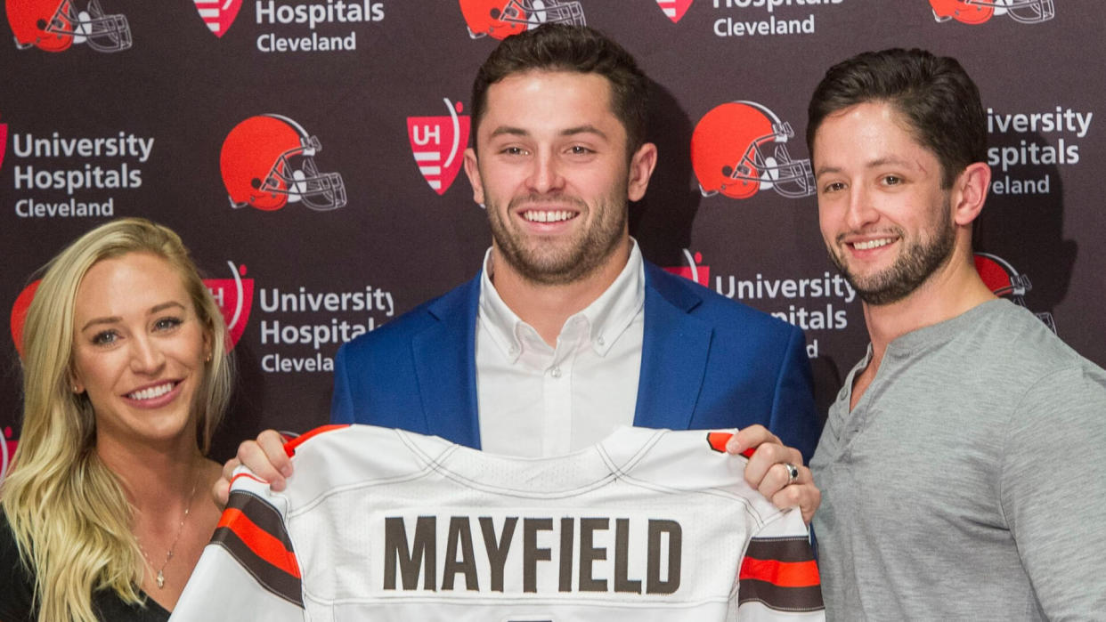 Mandatory Credit: Photo by Phil Long/AP/Shutterstock (9644685b)Cleveland Browns first-round draft pick Baker Mayfield, center, stands with his girlfriend, Emily Wilkinson, and brother Matt Mayfield after a news conference at the NFL football team's headquarters in Berea, Ohio, .