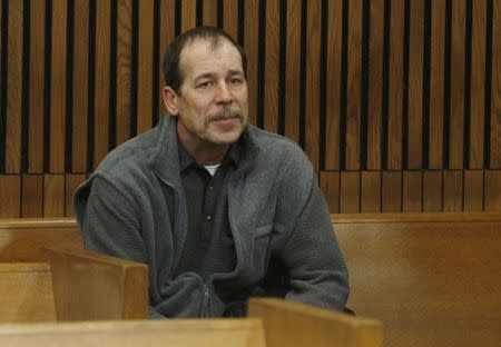 Theodore Wafer sits in the back of the court room before his arraignment in Detroit, Michigan in this file photo taken January 15, 2014, for the November 2, 2013 shooting death of Renisha McBride. REUTERS/Rebecca Cook/Files