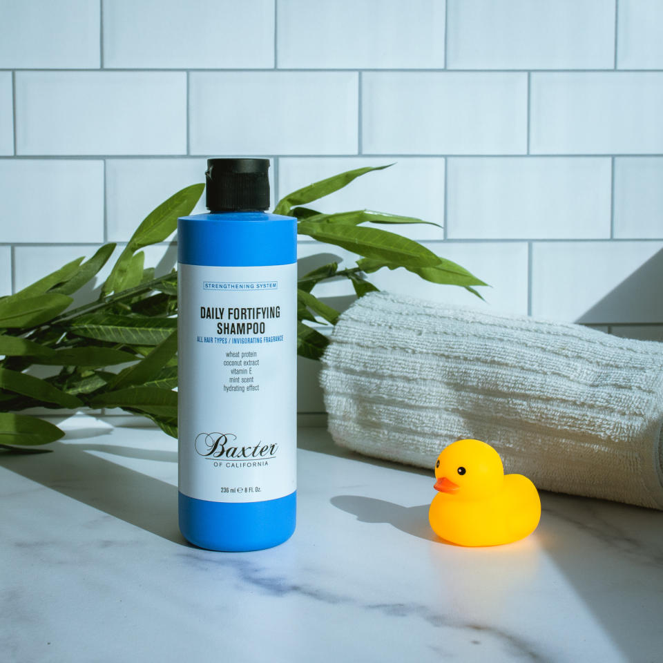 baxter shampoo on marble with tile background with rubber duckie