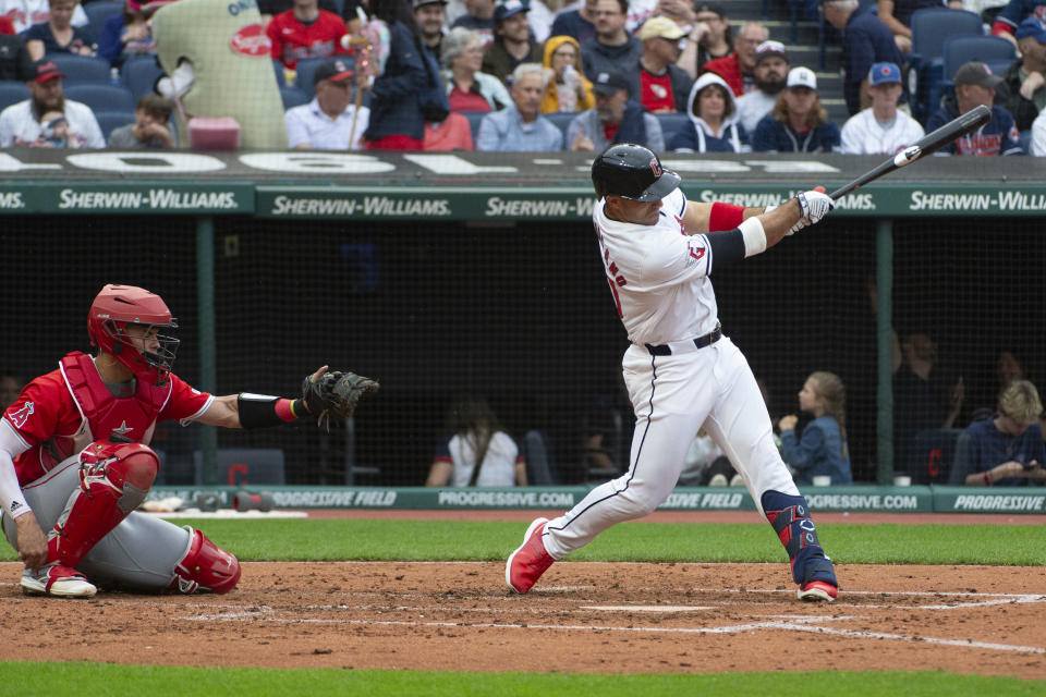 Cleveland Guardians' Ramon Laureano, right, watches his solo home run off Los Angeles Angels starting pitcher Reid Detmers as Angels catcher Logan O'Hoppe, left, looks on during the fourth inning of a baseball game in Cleveland, Saturday, May 4, 2024. (AP Photo/Phil Long)