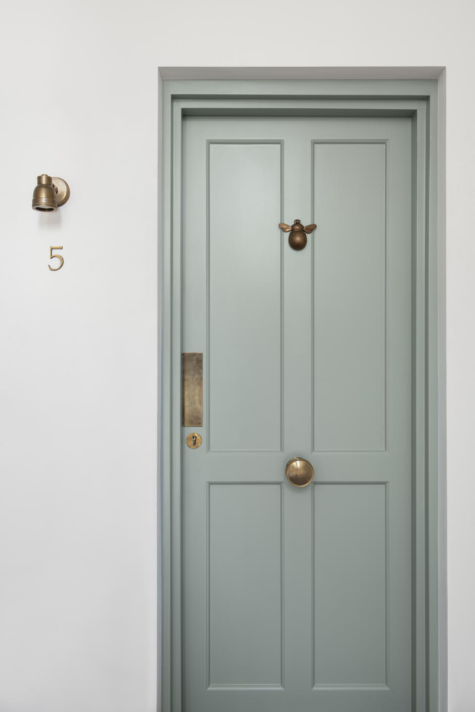 A light pastel green front door