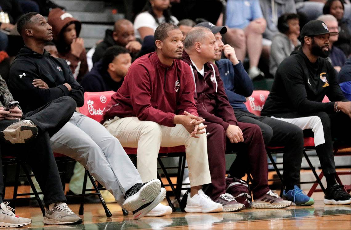 South Carolina head coach Lamont Paris, center, and assistant coach Eddie Shannon, left, look on during the Prolific Prep game featuring forward AJ Dybantsa at the 2023 Chick-fil-A Classic at River Bluff High School.
