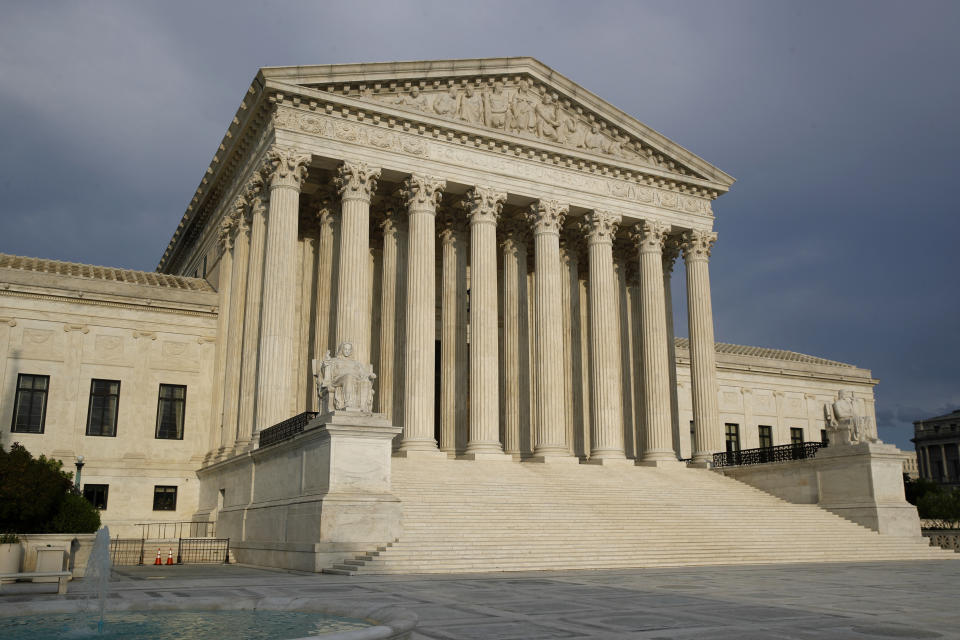 FILE - In this May 3, 2020, file photo, the setting sun shines on the Supreme Court building in Washington. As coronavirus cases surge again nationwide, the Supreme Court late Wednesday, Nov. 25, temporarily barred New York from enforcing certain attendance limits at houses of worship in areas designated as hard hit by the virus. The court’s action won’t have any immediate impact since the two groups that sued as a result of the restrictions, the Catholic church and Orthodox Jewish synagogues, are no longer subject to them. (AP Photo/Patrick Semansky, File)