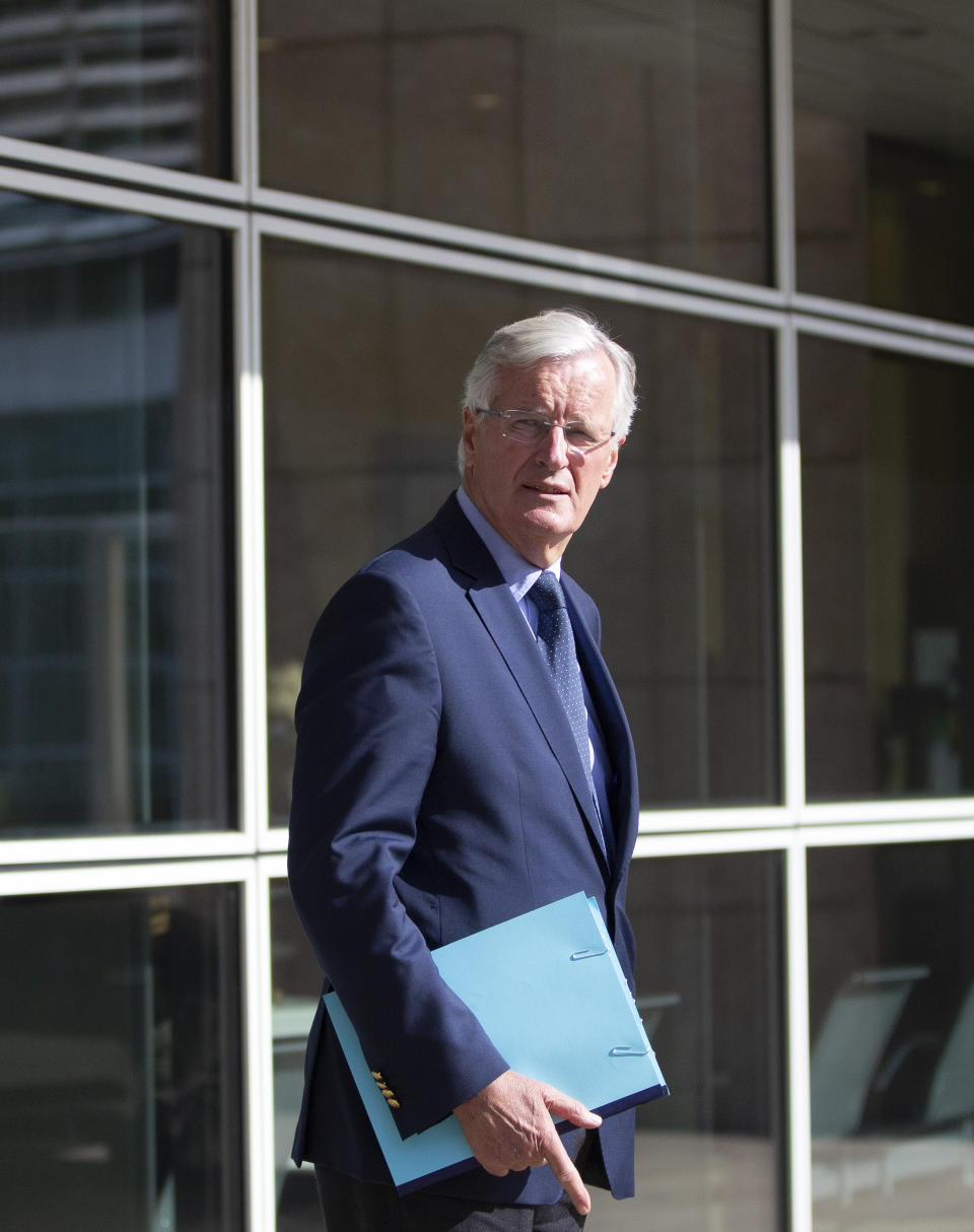 European Union chief Brexit negotiator Michel Barnier waits outside of EU headquarters in Brussels for the arrival of Irish Foreign Minister Simon Coveney, Friday, Sept. 27, 2019. Michel Barnier is meeting with Irish Foreign Minister Simon Coveney and UK Brexit secretary Stephen Barclay seeking a way to unblock the stalled negotiations on Britain's withdrawal from the bloc. (AP Photo/Virginia Mayo)
