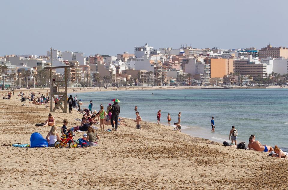 File picture of tourists  on Palma Beach in Palma de Majorca (AFP via Getty Images)
