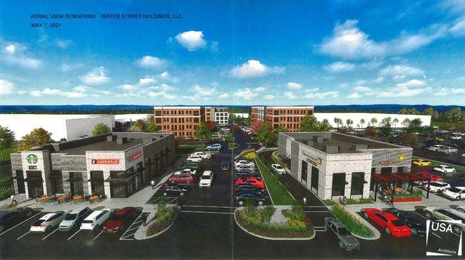 An architect rendering of the retail/residential complex now under construction at the corner of Water Street and South Park Drive in Newton. The view is from above Water Street looking toward the east.