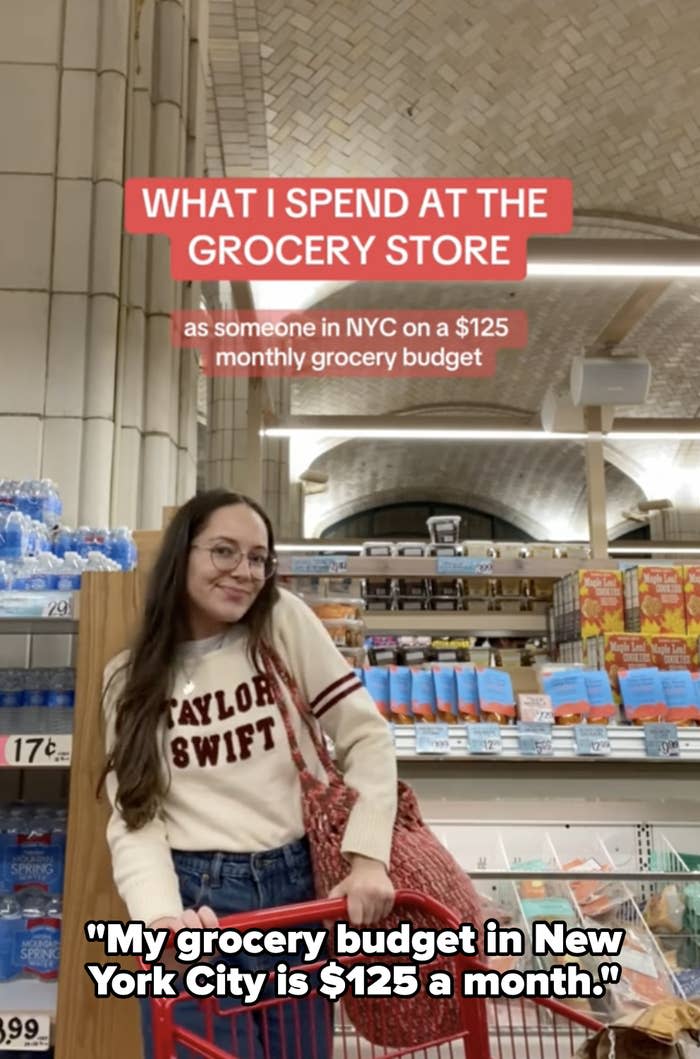 Maria holding a shopping cart in a Trader Joe's grocery aisle with quote, "My grocery budget in New York City is $125 a month"