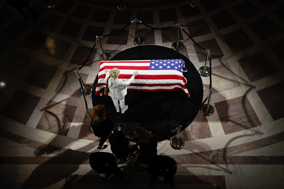 Lynne Kennedy, sister of U.S. Sen. Dianne Feinstein, places her hand on Feinstein's casket at City Hall Wednesday, Oct. 4, 2023, in San Francisco. Feinstein, who died Sept. 29, served as San Francisco's mayor. (AP Photo/Godofredo A. Vásquez)