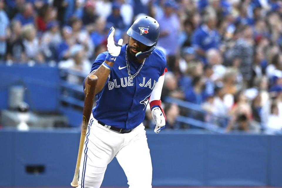 Toronto Blue Jays' Teoscar Hernandez drops his bat after hitting a two-run double against the Boston Red Sox during the first inning of a baseball game Tuesday, June 28, 2022, in Toronto. (Jon Blacker/The Canadian Press via AP)