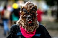 <p>An opposition demonstrator wearing a mask takes part in an anti-government protest in Caracas, on July 26, 2017. (Photo: Federico Parra/AFP/Getty Images) </p>