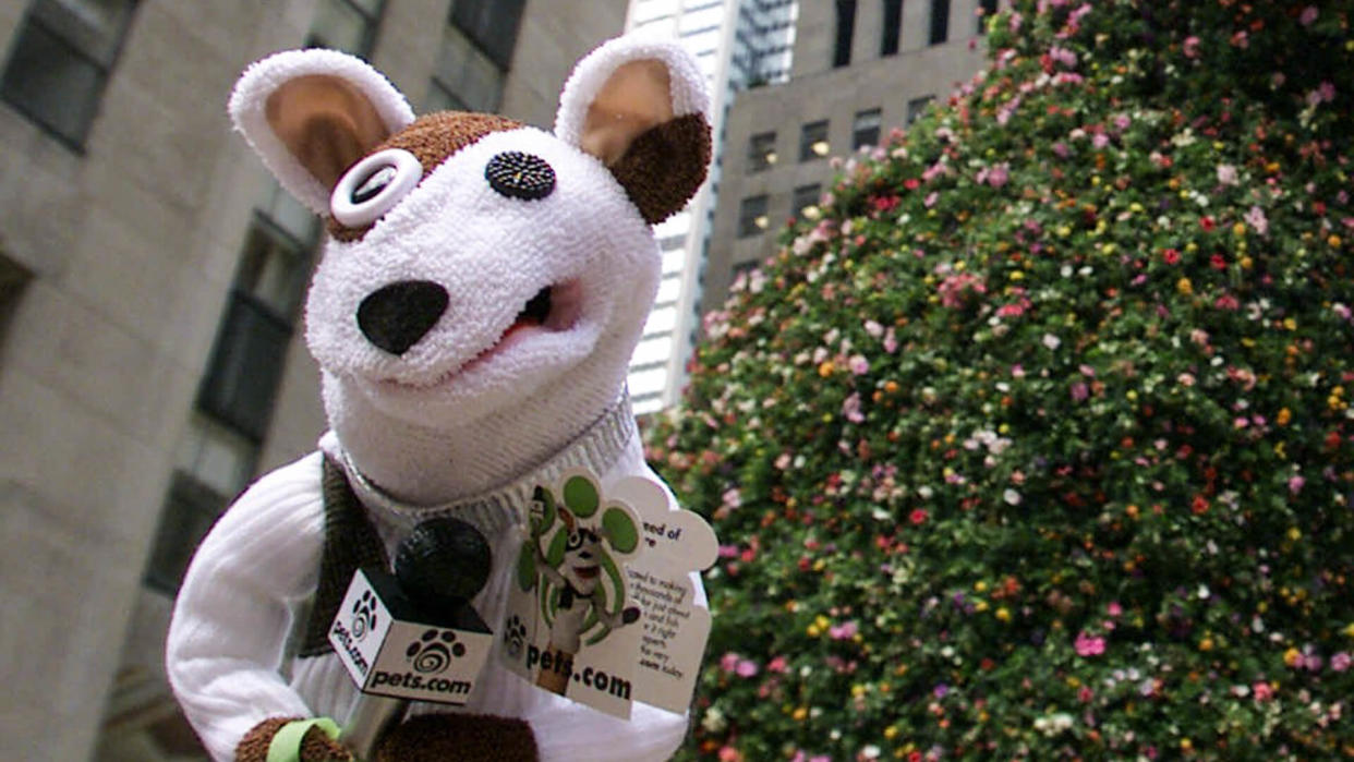 The Pets.com Sock Puppet makes an appearance near Jeff Koons' 