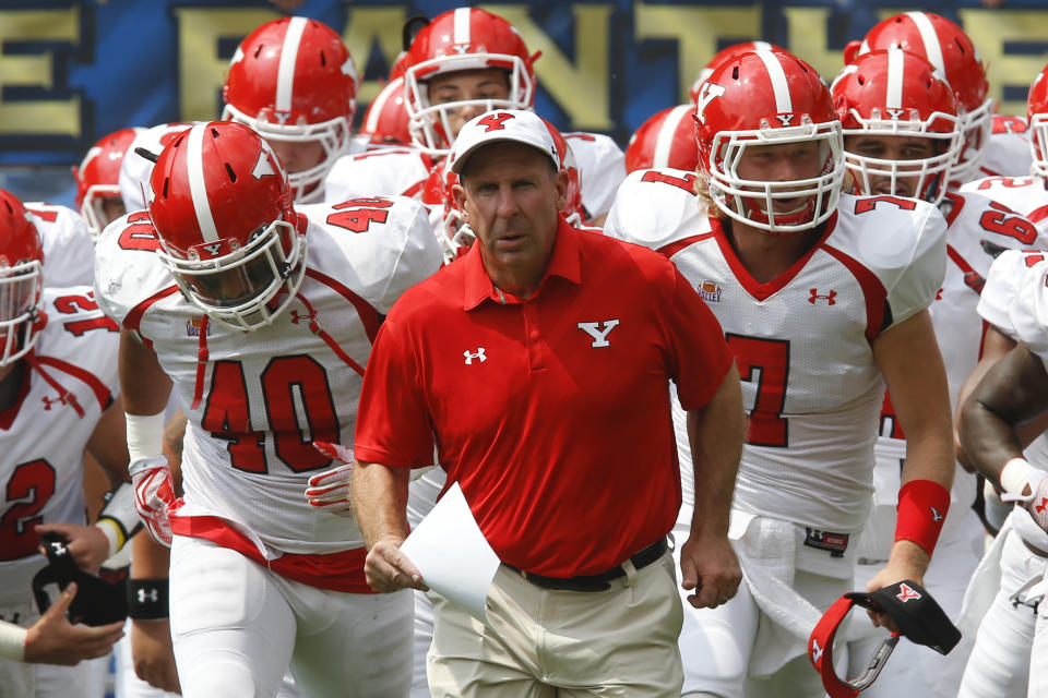 Youngstown State head coach Bo Pelini leads his team on to the field before an NCAA football game between the Pittsburgh and the Youngstown State Penguins, Saturday, Sept. 5, 2015 in Pittsburgh. (AP Photo/Keith Srakocic)