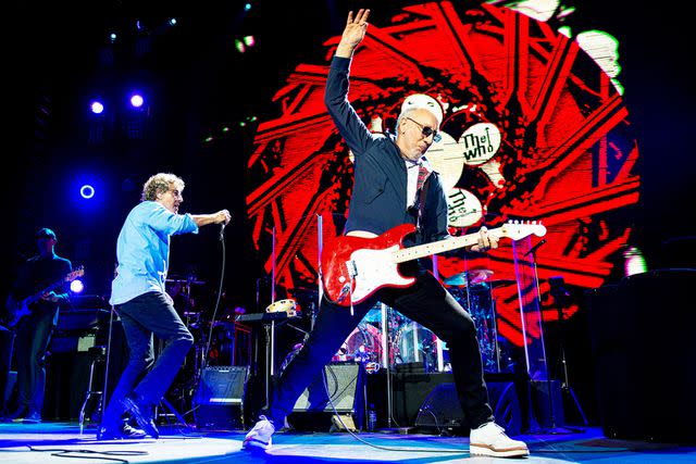 <p>Neil Lupin/Redferns/Getty</p> Roger Daltrey and Pete Townshend of The Who performing in London in March 2015