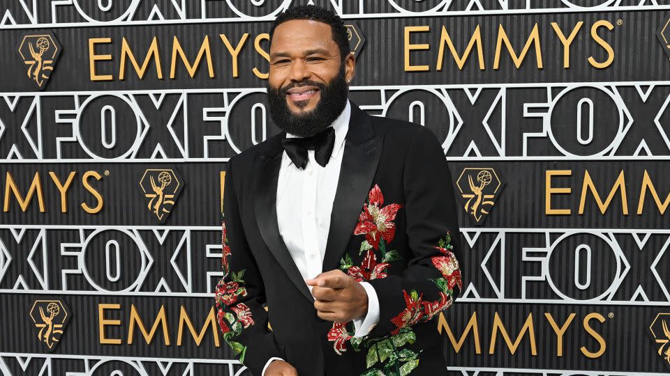 Emmy’s host Anthony Anderson put a fun spin on black-tie tradition in an Etro tuxedo with beaded lily design. - Gilbert Flores/Variety/Getty Images