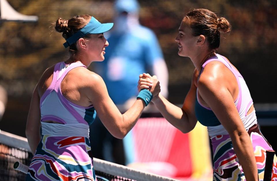 Belinda Bencic and Aryna Sabalenka shake hands at the end of the match.