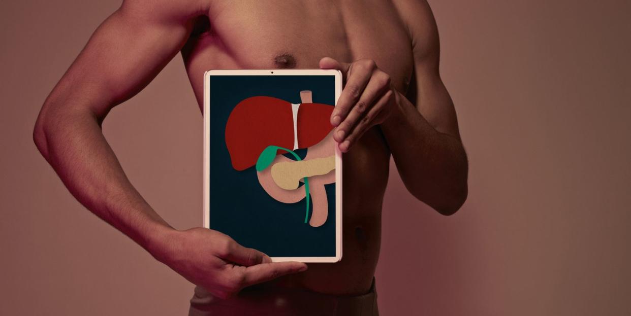 young man holding tablet in front of body to display liver