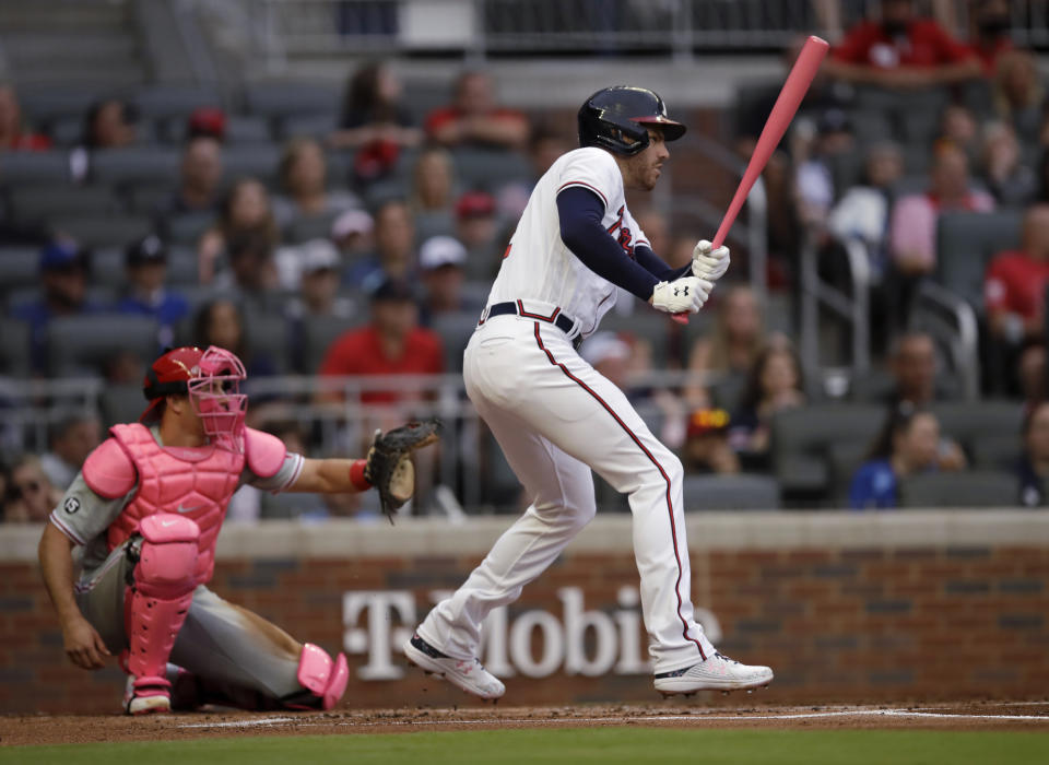 Atlanta Braves' Freddie Freeman watches his RBI single off Philadelphia Phillies pitcher Aaron Nola during the first inning of a baseball game Sunday, May 9, 2021, in Atlanta. (AP Photo/Ben Margot)