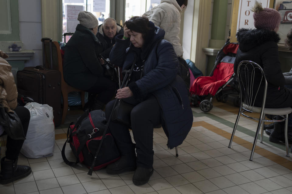 People who fled the war in Ukraine wait at Przemysl train station in Przemysl, Poland, Tuesday, March 15, 2022. (AP Photo/Petros Giannakouris)