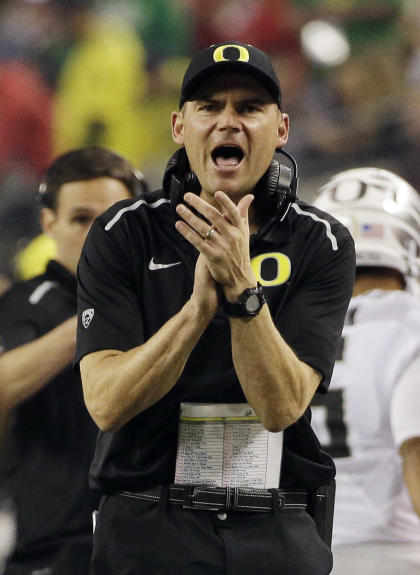 Oregon head coach Mark Helfrich reacts during the first half of the NCAA college football playoff championship game against Ohio State Monday, Jan. 12, 2015, in Arlington, Texas. (AP Photo/David J. Phillip)