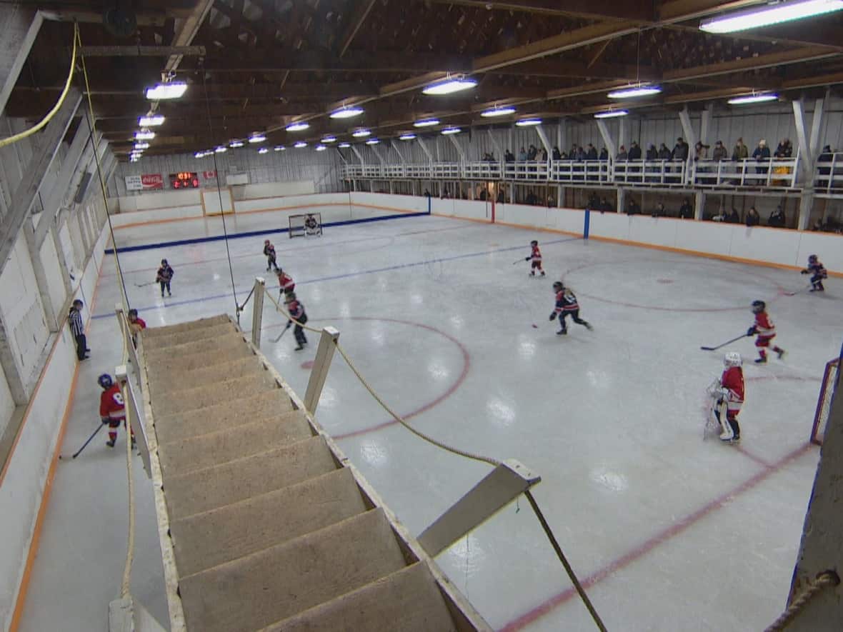A 95-year-old rink is getting internet attention for its unique entrance — a drawbridge that drops from the roof to allow hockey players onto the ice from the second floor dressing rooms. (Adam Bent/CBC - image credit)
