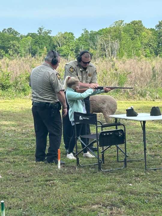 Members of Panola County Sheriff’s Office teaches a child about shotgun safety. Photo courtesy of Panola County Sheriff’s Office.