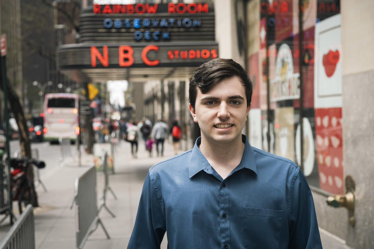 A journalism intern named Sky Cabtree standing in front of a sign at WNBC at 30 Rockefeller center in Manhattan, NY