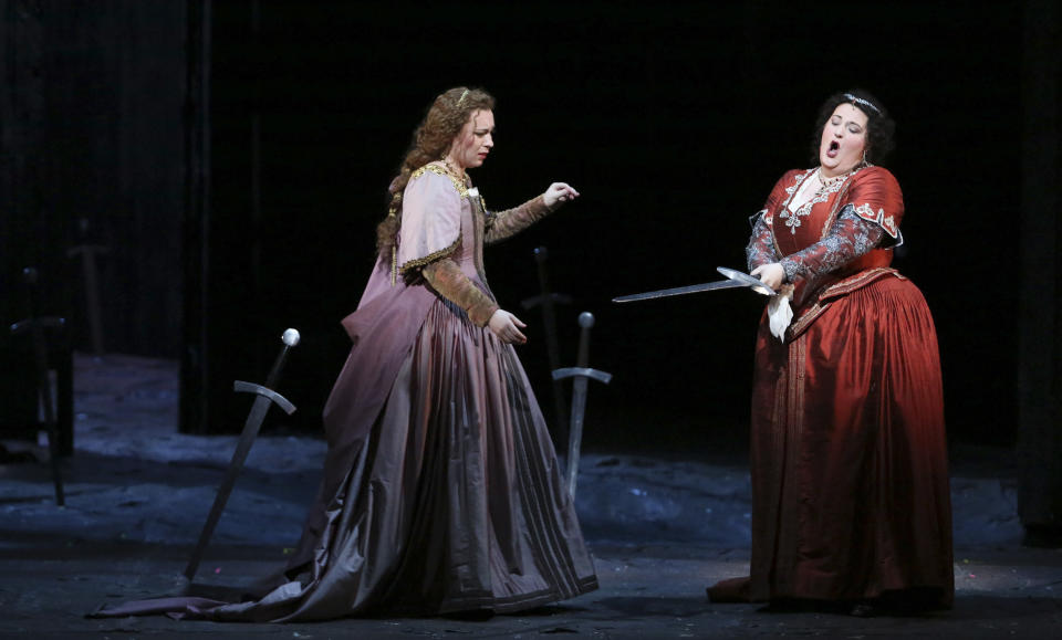 This photo provided by the Houston Grand Opera shows Natalya Romaniw, left, performing the role of Ines and Tamara Wilson as Leonora in Il Trovatore in Houston. (AP Photo/Houston Grand Opera, Felix Sanchez