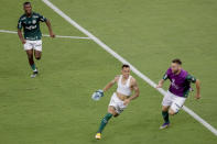 Breno Lopes of Brazil's Palmeiras, bottom left, celebrates scoring against Brazil's Santos the only goal of the Copa Libertadores final soccer match at the Maracana stadium in Rio de Janerio, Brazil, Saturday, Jan. 30, 2021. (AP Photo/Silvia Izquierdo)