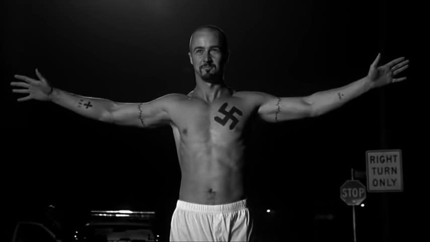 Derek Vinyard in his boxers with his arms spread out in "American History X"