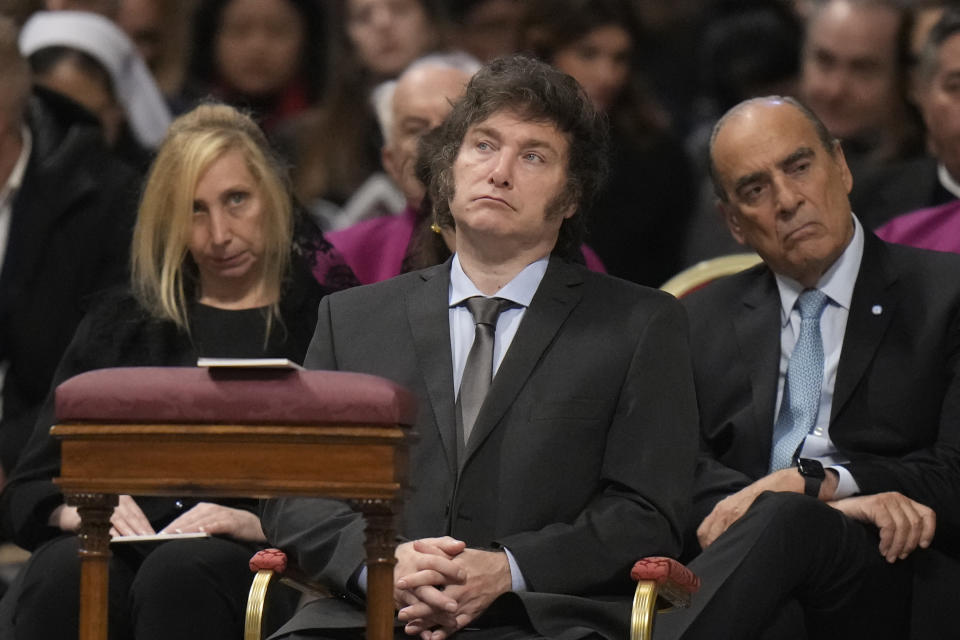 From left, Argentine Secretary-General of the Presidency Karina Milei, Argentine President Javier Milei, and Interior Minister Guillermo Francos attend the canonization of new Argentine Saint, María Antonia de Paz y Figueroa also known as "Mama Antula" presided over by Pope Francis in St. Peter's Basilica at The Vatican, Sunday, Feb. 11, 2024. (AP Photo/Alessandra Tarantino)