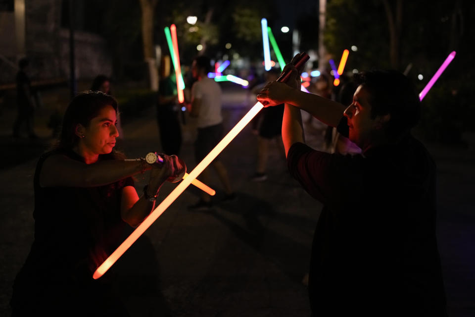 Students of the Jedi Knight Academy practice techniques with lightsabers at a park in Mexico City, late Saturday, June 15, 2024. The academy is a lightsaber combat and choreography school founded in 2019 and a dream come true for fans of Star Wars. (AP Photo/Eduardo Verdugo)