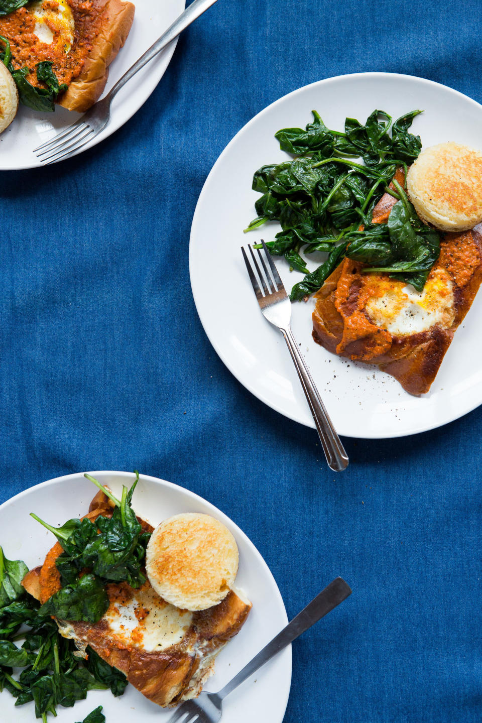 <strong>Get the <a href="http://www.dinnerwasdelicious.com/egg-in-a-hole-with-smoky-red-pepper-romesco-and-garlicky-greens/" target="_blank">Eggs In A Hole with Smoky Red Pepper Romesco and Garlicky Greens</a>&nbsp;recipe from Dinner Was Delicious</strong>