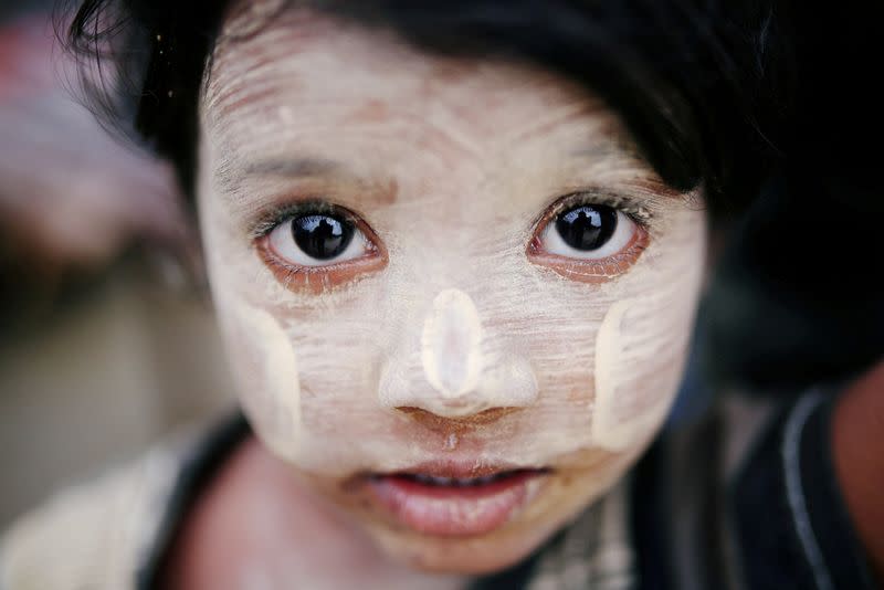 FILE PHOTO: A Rohingya refugee child with thanaka paste is seen in Cox's Bazar